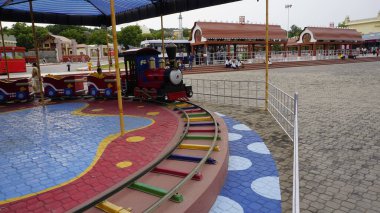 Hyderabad, Telangana,India-August 03 2023: Train with small tracks for entertaining kids in ramoji film city amusement park clipart