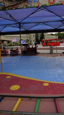 Hyderabad, Telangana,India-August 03 2023: Train with small tracks for entertaining kids in ramoji film city amusement park clipart