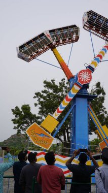 Hyderabad, Telangana,India-August 03 2023: Kamikaze thriller rider game for kids and adults in ramoji film city amusement park. clipart