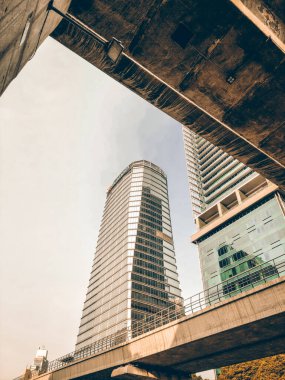 Modern corporate buildings against blue sky. High-rise buildings in Jakarta. Blue colored skyscrapers of business center.