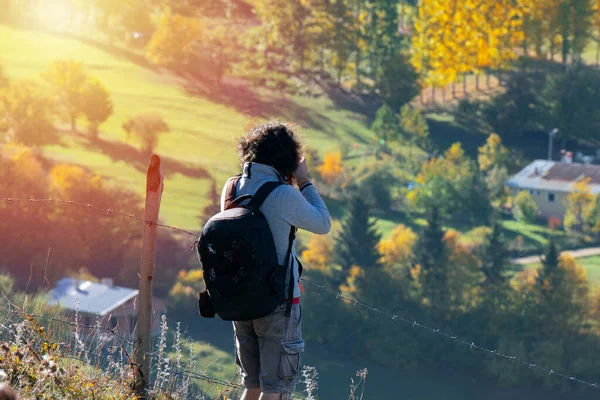 stock image Young man traveler looking and photographing beautiful autumn in Turkey, Travel lifestyle concept.