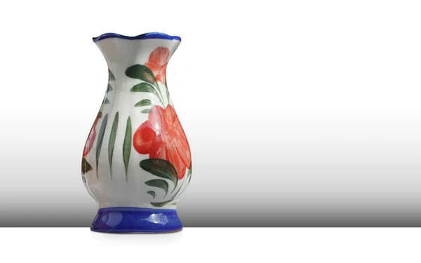 white and blue and red ceramic vase on grey wall and white floor background, object, vintage, modern, copy space
