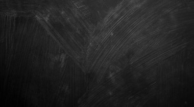 Doğal boya fırçası vuruşunun siyah duvar arkaplanı çimento ya da taş kadar eski. somut doku korku ve cadılar bayramı kavramı olarak