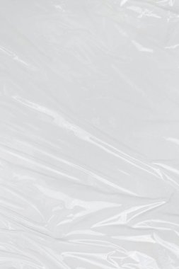 Dikey transparant kırışık plastik, beyaz plastik veya polietilen çanta dokusu, makro, beyaz arkaplan