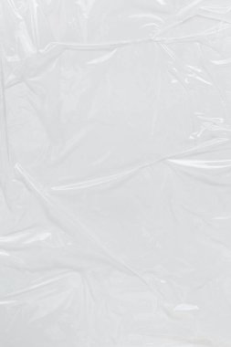 Dikey transparant kırışık plastik, beyaz plastik veya polietilen çanta dokusu, makro, beyaz arkaplan