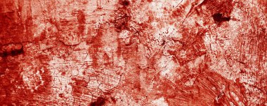 Kırmızı boya lekeleri taze kanı andırıyor. Tırtıklı kenarları rahatsızlık hissi veriyor. Lekeler, Cadılar Bayramı dehşetini hatırlatıyor..