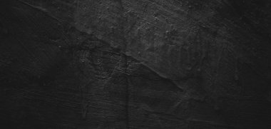 Doğal boya fırçası vuruşunun siyah arkaplanı çimento desenli ya da taş kadar eski. Dehşet çimento dokusu. Korkunç bir geçmişi var. Duvar Betonu Yaşlı siyah