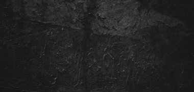 Doğal boya fırçası vuruşunun siyah arkaplanı çimento desenli ya da taş kadar eski. Dehşet çimento dokusu. Korkunç bir geçmişi var. Duvar Betonu Yaşlı siyah