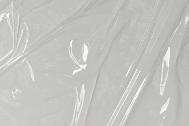 Beyaz arka planda plastik şeffaf selofan çanta. Beyaz plastik film ambalajlı arka plan. Beyaz Plastik Torba Dokusu