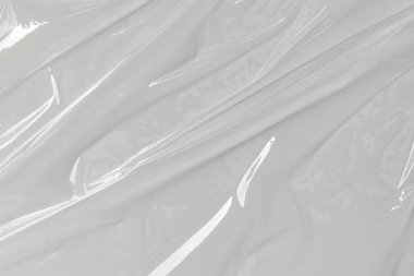 Beyaz arka planda plastik şeffaf selofan çanta. Beyaz plastik film ambalajlı arka plan. Beyaz Plastik Torba Dokusu