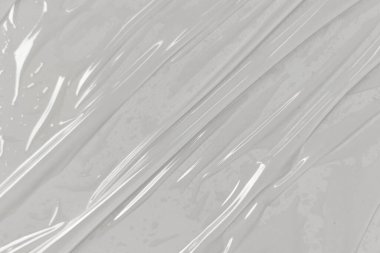 Beyaz arka planda plastik şeffaf selofan çanta. Beyaz plastik film ambalajlı arka plan. Beyaz Plastik Torba Dokusu