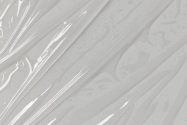 Beyaz arka planda plastik şeffaf selofan çanta. Beyaz plastik film ambalajlı arka plan. Beyaz Plastik Torba Dokusu