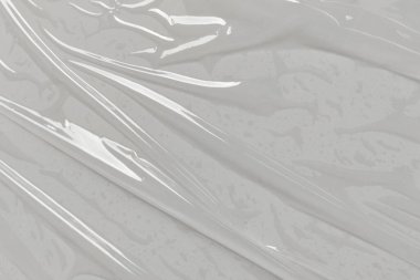 Beyaz arka planda plastik şeffaf selofan çanta. Beyaz plastik film ambalajlı arka plan. Beyaz Plastik Torba Dokusu