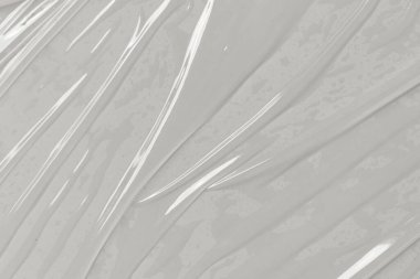 Beyaz arka planda plastik şeffaf selofan çanta. Beyaz plastik film ambalajlı arka plan. Beyaz Plastik Torba Dokusu