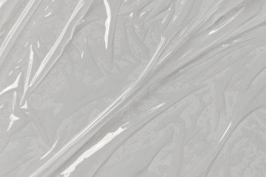 Beyaz arka planda plastik şeffaf selofan çanta. Beyaz plastik film ambalajlı arka plan. Beyaz Plastik Torba Dokusu