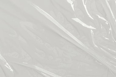 Beyaz arka planda plastik şeffaf selofan çanta. Beyaz plastik film ambalajlı arka plan. Beyaz Plastik Torba Dokusu