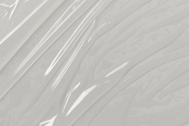 Beyaz arka planda plastik şeffaf selofan çanta. Beyaz plastik film ambalajlı arka plan. Beyaz Plastik Torba Dokusu