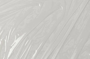 Beyaz arka planda plastik şeffaf selofan çanta. Beyaz plastik film ambalajlı arka plan. Beyaz Plastik Torba Dokusu