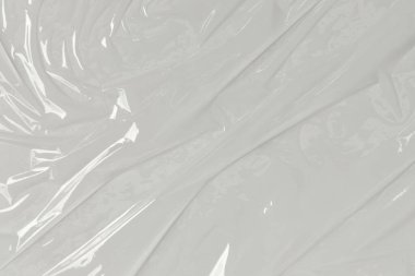 Beyaz arka planda plastik şeffaf selofan çanta. Beyaz plastik film ambalajlı arka plan. Beyaz Plastik Torba Dokusu