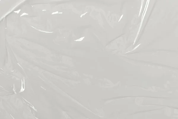 Plastic transparent cellophane bag on white background. White plastic film wrap texture background. White Plastic Bag Texture
