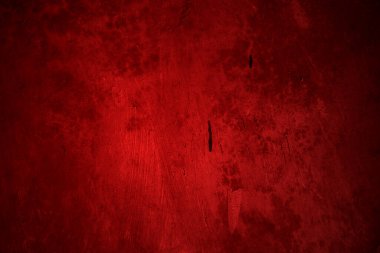 Kırmızı duvar dokusu arka plan. Arka plan için korkunç kırmızı duvar, eski püskü kan boyası ve alçı çatlakları..