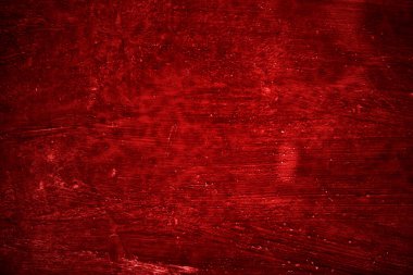 Kırmızı duvar dokusu arka plan. Arka plan için korkunç kırmızı duvar, eski püskü kan boyası ve alçı çatlakları..