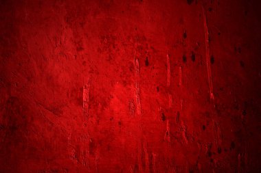 Kırmızı duvar dokusu arka plan. Arka plan için korkunç kırmızı duvar, eski püskü kan boyası ve alçı çatlakları..
