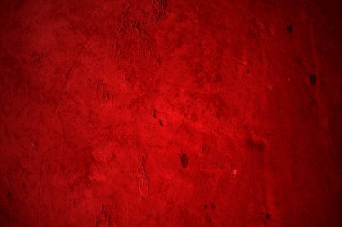 Kırmızı duvar dokusu arka plan. Arka plan için korkunç kırmızı duvar, eski püskü kan boyası ve alçı çatlakları..
