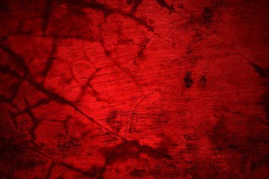 Kırmızı duvar dokusu arka plan. Arka plan için korkunç kırmızı duvar, eski püskü kan boyası ve alçı çatlakları..