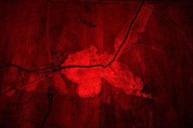 Kırmızı duvar dokusu arka plan. Arka plan için korkunç kırmızı duvar, eski püskü kan boyası ve alçı çatlakları..