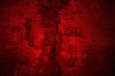 Kırmızı duvar dokusu arka plan. Arka plan için korkunç kırmızı duvar, eski püskü kan boyası ve alçı çatlakları..
