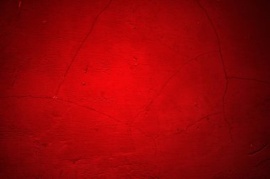 Kırmızı duvar dokusu arka plan. Arka plan için korkunç kırmızı duvar, eski püskü kan boyası ve alçı çatlakları..
