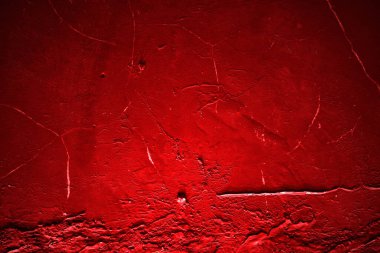 Kırmızı duvar dokusu arka plan. Arka plan için korkunç kırmızı duvar, eski püskü kan boyası ve alçı çatlakları..