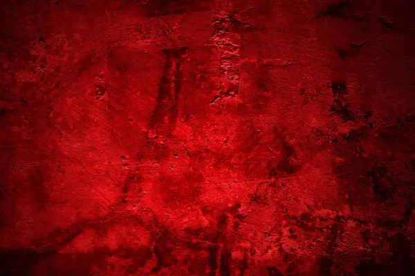 Kırmızı duvar dokusu arka plan. Arka plan için korkunç kırmızı duvar, eski püskü kan boyası ve alçı çatlakları..