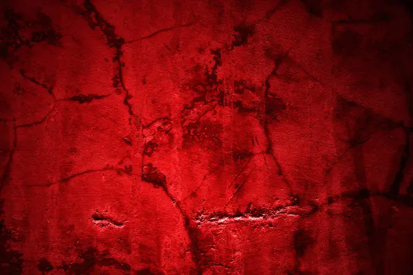 Kırmızı duvar dokusu arka plan. Arka plan için korkunç kırmızı duvar, eski püskü kan boyası ve alçı çatlakları..