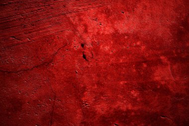 Kırmızı duvar dokusu arka plan. Arka plan için korkunç kırmızı duvar, eski püskü kan boyası ve alçı çatlakları..