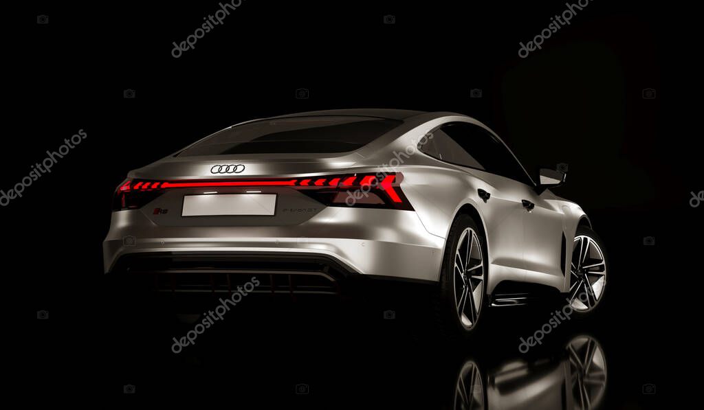 Audi RS e-tron GT electric sports car at the dark background. Almaty, Kazakhstan - January 10, 2023.