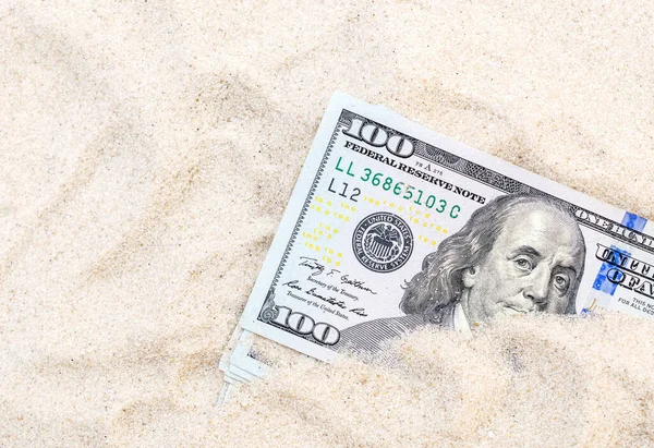 Money hidden in the sand.