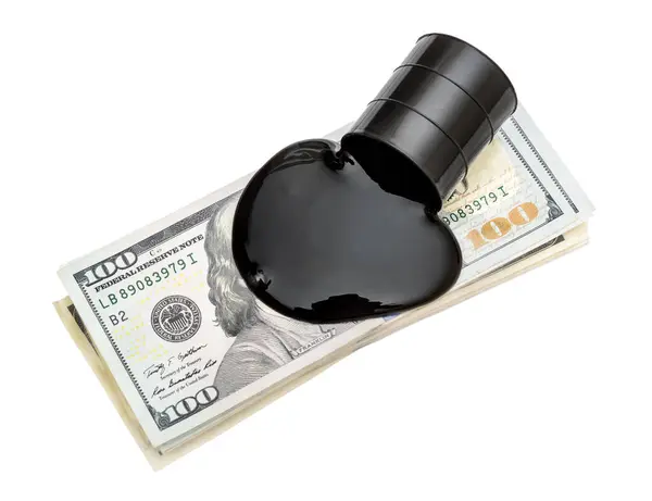 stock image Crude oil spilled from barrel on stack of dollar bills. Isolated on white. Top view. Business concept.