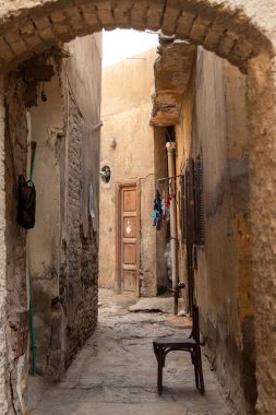Vertical view of empty old traditional street in arab poor country in daily life, Cairo, Egypt