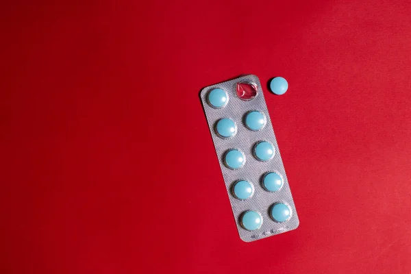 stock image plates with pills on a red background