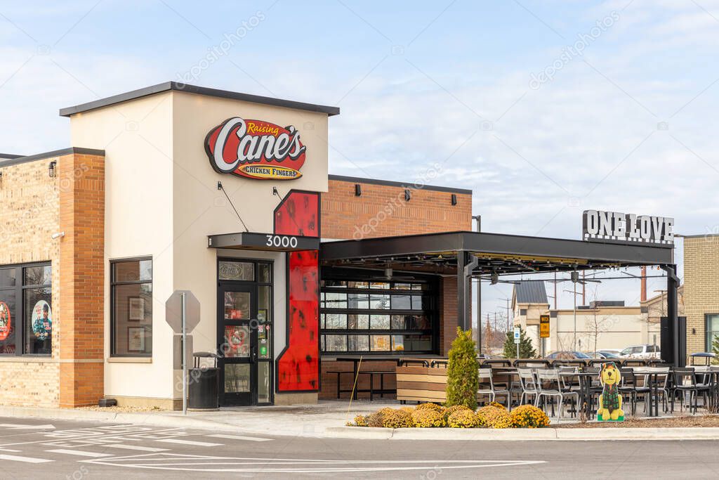 JOLIET, IL, USA - NOVEMBER 24, 2022: Raising Cane's is an American fast food restaurant chain that specializes in chicken fingers.