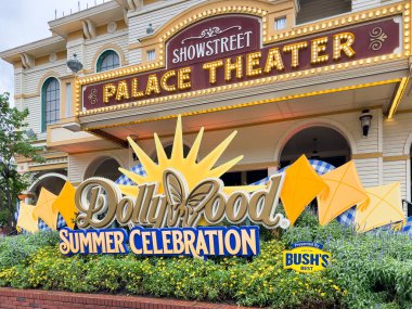 PIGEON FORGE, TN, USA - AUGUST 1, 2022: The entrance to Dollywood with the amusement park logo. Dollywood is Dolly Parton's famous amusement park located in the Smoky Mountains. clipart