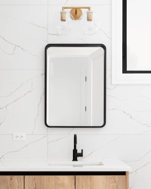 Ahşap bir dolabı, mermer döşeli bir duvarı ve siyah çerçeve aynası ve musluğu olan bir banyo ayrıntısı..