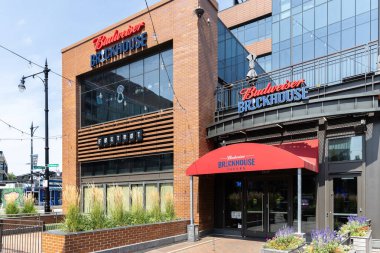 Chicago, IL, USA - August 14, 2024: The Budweiser Brickhouse Tavern is in Gallagher Way, outside of Wrigley Field, and is a sports bar serving American food and drinks. clipart