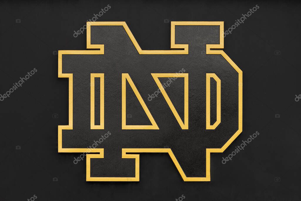 Notre Dame, IN, USA - October 25, 2024: The University of Notre Dame Fighting Irish logo with a black background and a gold outline edge.
