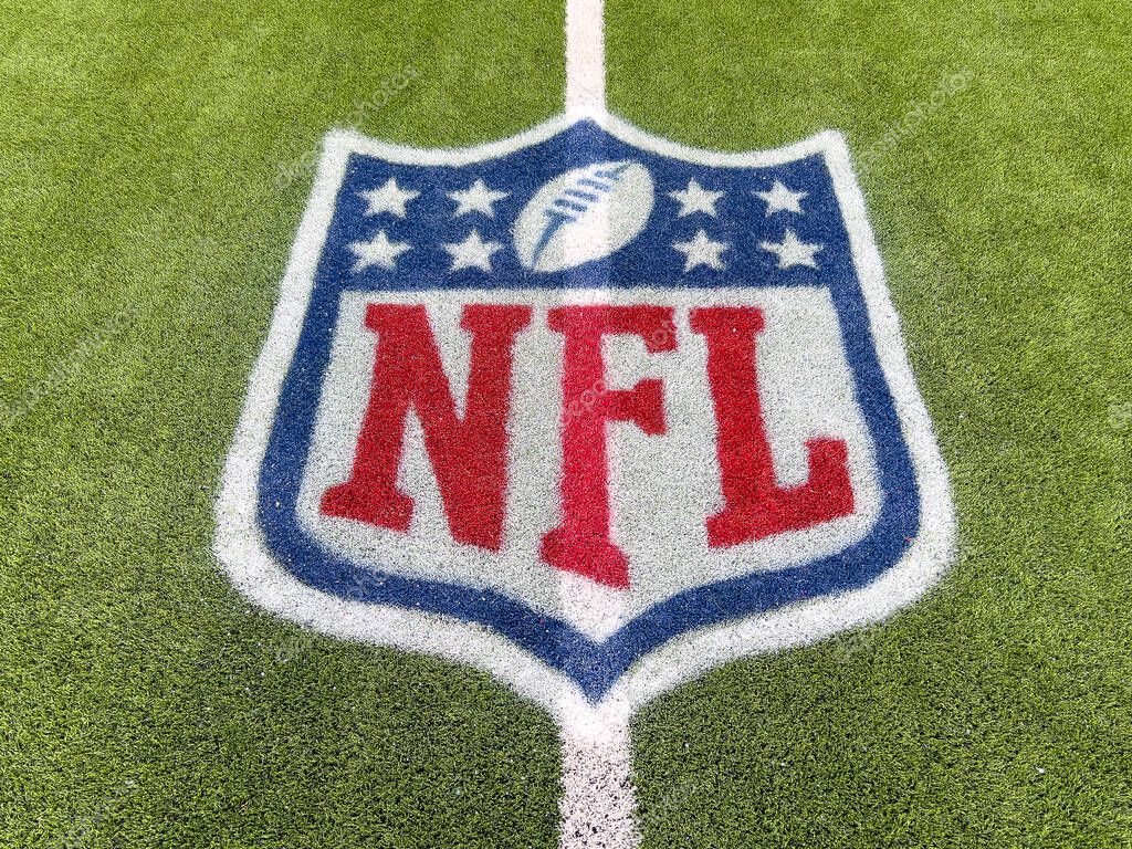 Inglewood, CA, USA - November 14, 2024: An NFL logo on a green artificial grass football field line in full color.