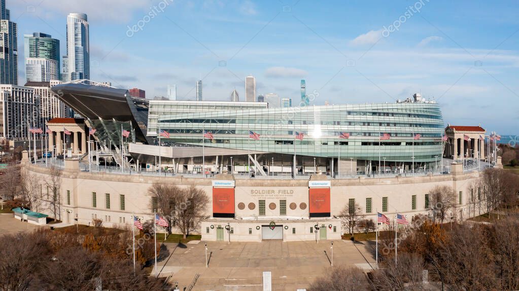 Chicago, IL, USA - December 18, 2024: An aerial view of Soldier Field, home to the Chicago Bears, looking towards the Chicago skyline.