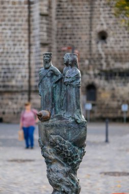 Quedlinburg, Germany, 28 October 2022:  Monument near St. Benedict church, Personalities from history, fountain, dog Quedel heraldic animal, Dorothea Christiane Erxleben, Heinrich I and Mathilde