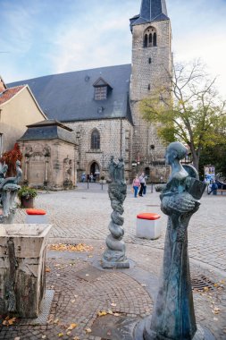 Quedlinburg, Germany, 28 October 2022:  Monument near St. Benedict church, Personalities from history, fountain, dog Quedel heraldic animal, Dorothea Christiane Erxleben, Heinrich I and Mathilde
